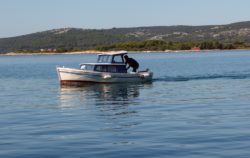 Small Boat At Sea