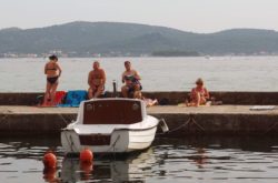 People Relaxing On The Pier