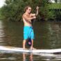 Man Stands at Paddle Board