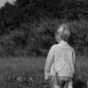 B&W photography of a child in the meadow