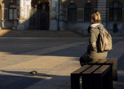 Waiting woman with a pigeon