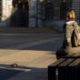 Waiting woman with a pigeon