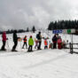 Queue of skiers at ski lift