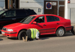 Man changing the punctured tyre