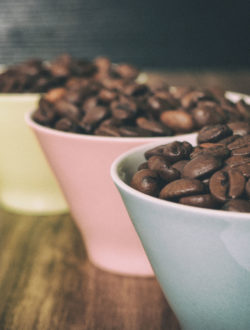 Three cups with coffee beans