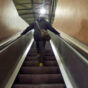 Man On Escalator In Tube