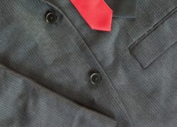 Dark Men’s Jacket With A Red Tie