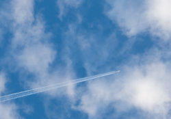 Airplane On The Cloudy Sky