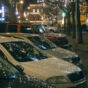 Christmas Lights Reflected On Car Hoods