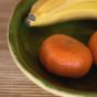 Still life with fruits in ceramic bowl