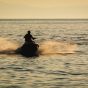 Jet Ski on the Sea at Sunset