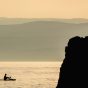 Silhouette of a Man on a Paddleboard at Sunset in Croatia